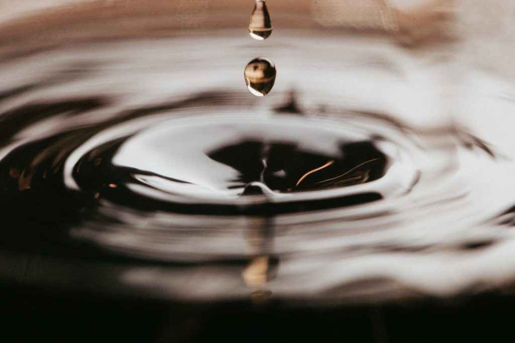 macro photography closeup of water drop and ripples